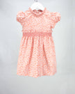 pink and orange smocked fall floral dress