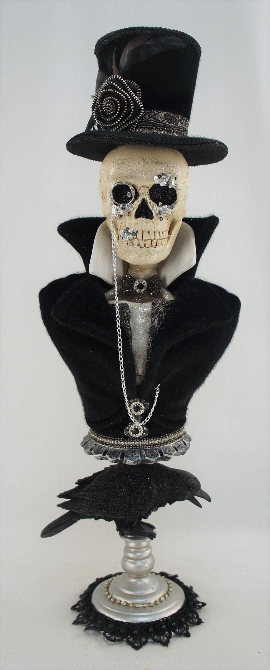 decorative skeleton on a pedestal
