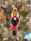 red gold crown nutcracker ornament
